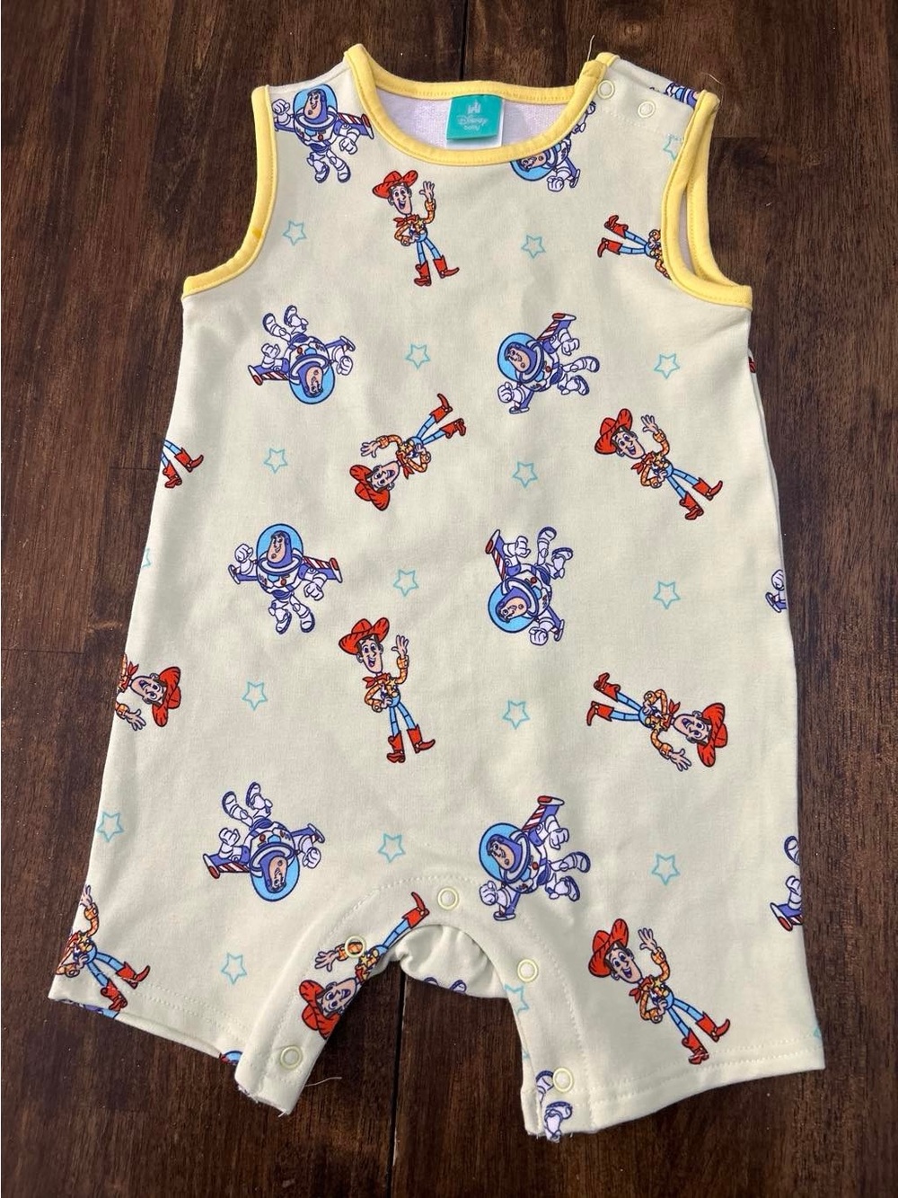 Disney Baby Yellow Trim Character Bib with Blue and Red Accents